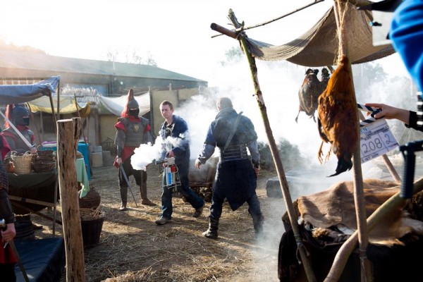 Colin Smith uses an Artem smoke gun to fog the set before a take