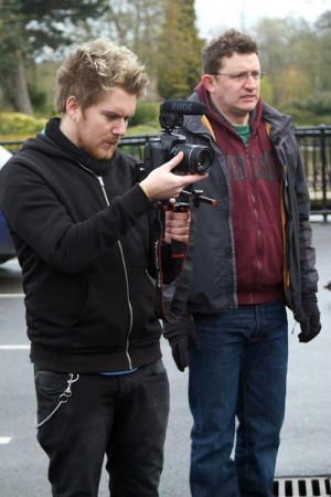 Brett Chapman shoots B-roll on Stop/Eject as Hadrian Cawthorne looks on.